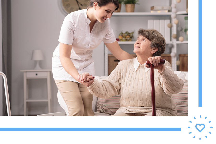 caretaker helping grandmother get up