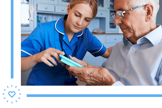 caretaker reminding grandfather of his medicine